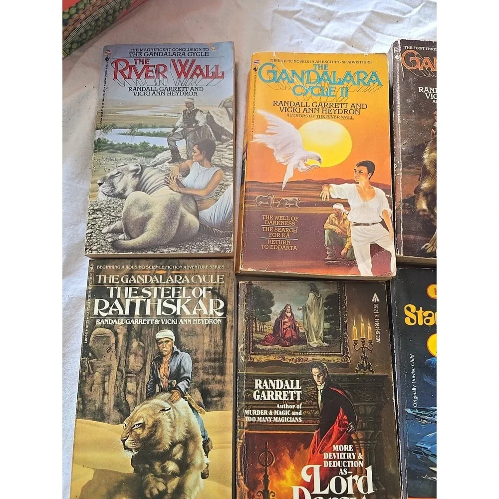 Lot of 9 Randall Garrett, Lisa Goldstein, Rick Cook & Christie Golden PB Books